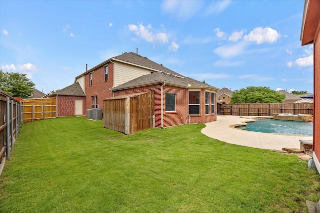 204 Leonard Way, Fate, TX 75087 - back of house with brick siding, cooling unit, a shingled roof, a pool with connected hot tub, and a patio