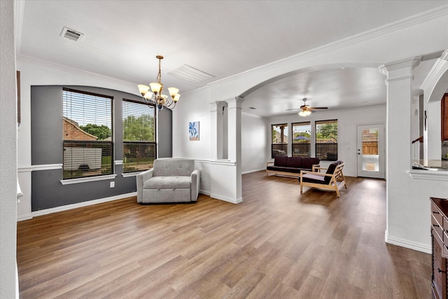 204 Leonard Way, Fate, TX 75087 - living area with decorative columns, wood finished floors, ceiling fan, arched walkways, and baseboards