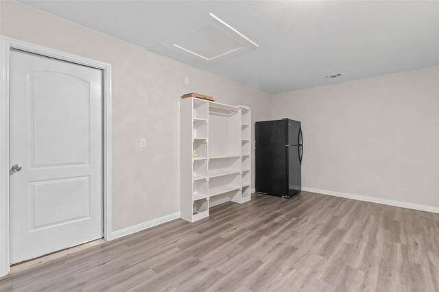 329 Cedar Creek Dr, Princeton, TX 75407 - unfurnished bedroom with freestanding refrigerator, wood finished floors, attic access, and baseboards
