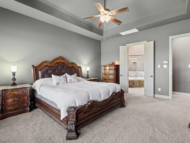 901 Egan Way Ct, Burleson, TX 76028 - carpeted bedroom with a raised ceiling, connected bathroom, baseboards, and a ceiling fan