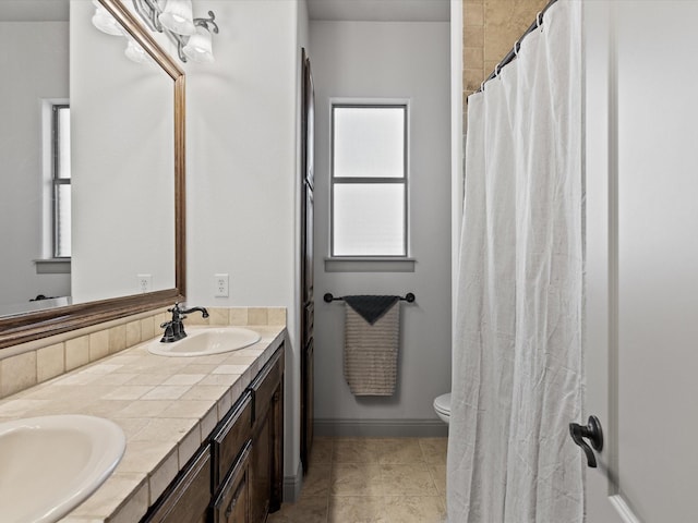 901 Egan Way Ct, Burleson, TX 76028 - full bathroom featuring double vanity, toilet, and tile patterned flooring