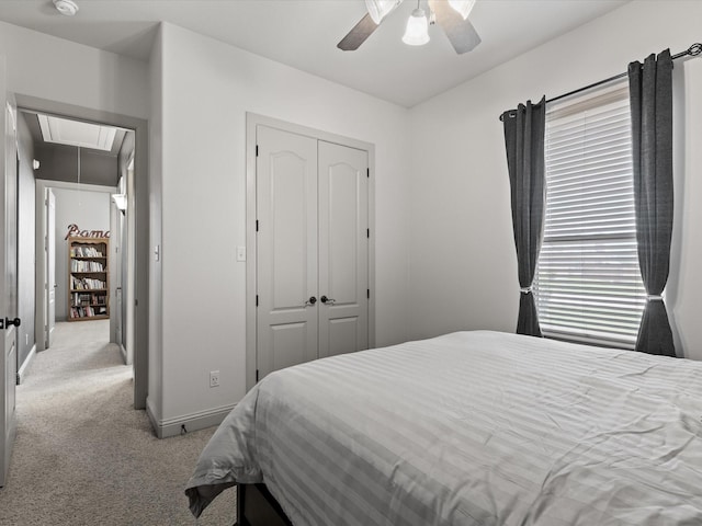 901 Egan Way Ct, Burleson, TX 76028 - bedroom with attic access, light carpet, a closet, a ceiling fan, and baseboards