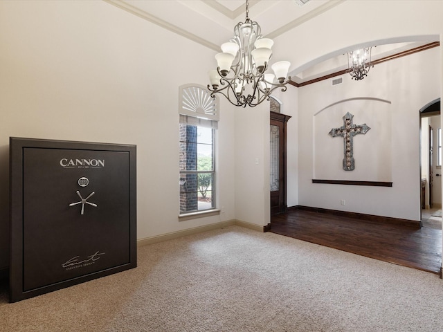901 Egan Way Ct, Burleson, TX 76028 - carpeted spare room with a chandelier, arched walkways, crown molding, a towering ceiling, and baseboards