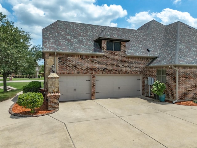 901 Egan Way Ct, Burleson, TX 76028 - view of front of house featuring concrete driveway, brick siding, a garage, and a shingled roof