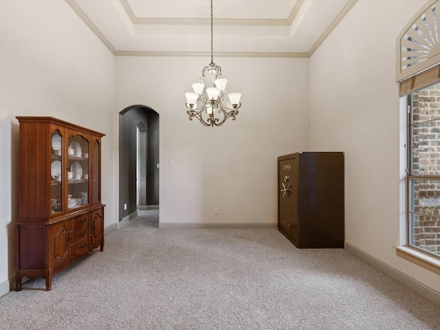 901 Egan Way Ct, Burleson, TX 76028 - carpeted empty room featuring arched walkways, a tray ceiling, a chandelier, baseboards, and ornamental molding