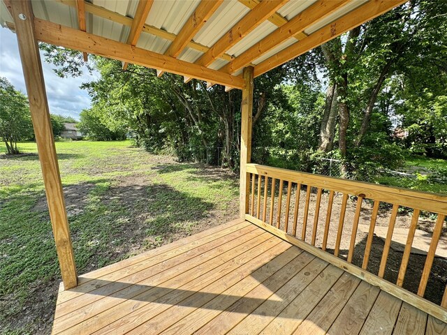 924 Gurley Ln, Waco, TX 76706 - wooden deck featuring a lawn and view of wooded area