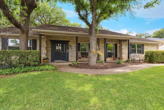 1133 Harris Ave, Hurst, TX 76053 - ranch-style house featuring a front lawn and a porch