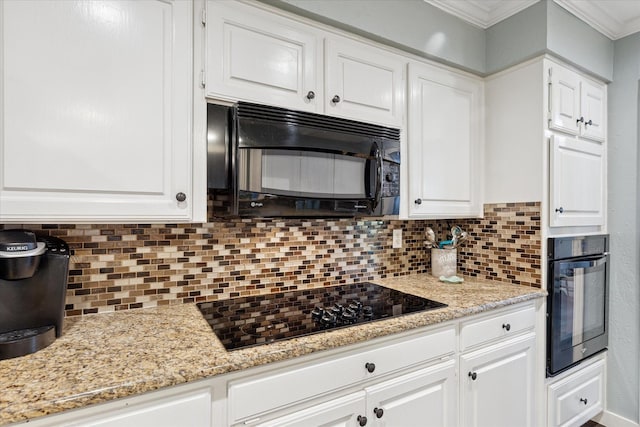 1133 Harris Ave, Hurst, TX 76053 - kitchen with black appliances, tasteful backsplash, white cabinetry, ornamental molding, and light stone counters