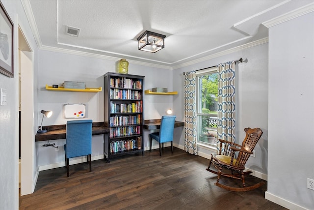 1133 Harris Ave, Hurst, TX 76053 - home office with wood finished floors, ornamental molding, a textured ceiling, baseboards, and built in desk