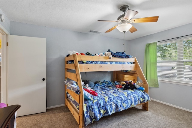 1133 Harris Ave, Hurst, TX 76053 - carpeted bedroom with a ceiling fan and baseboards
