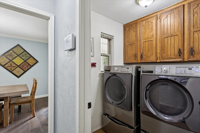 1133 Harris Ave, Hurst, TX 76053 - laundry room with washer and dryer, cabinet space, wood finished floors, baseboards, and ornamental molding