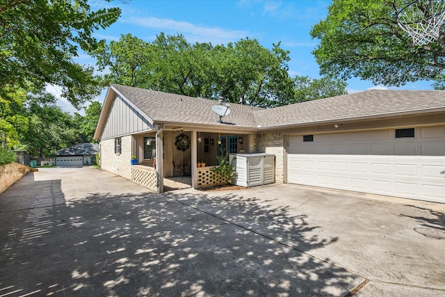 1133 Harris Ave, Hurst, TX 76053 - ranch-style home with concrete driveway, a garage, brick siding, and a shingled roof