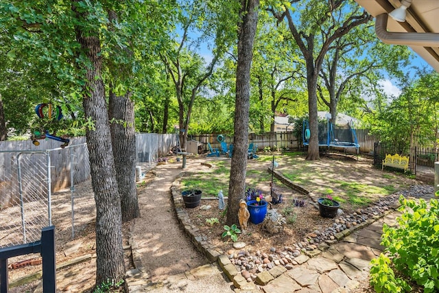 1133 Harris Ave, Hurst, TX 76053 - fenced backyard featuring a trampoline