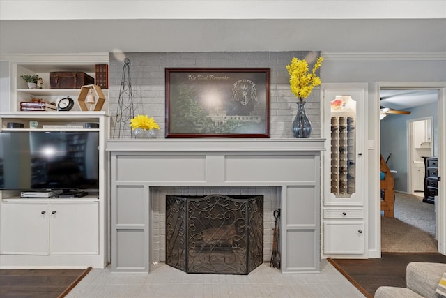 1133 Harris Ave, Hurst, TX 76053 - living room with a large fireplace, ornamental molding, and ceiling fan