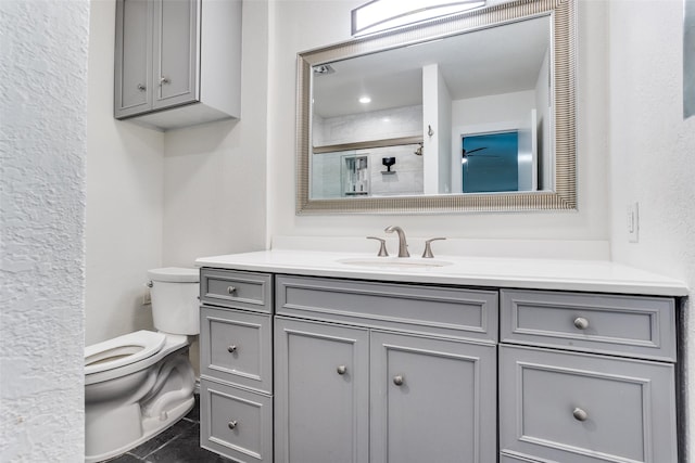1601 Elk Grove Dr, Richardson, TX 75081 - bathroom with toilet, vanity, and a shower