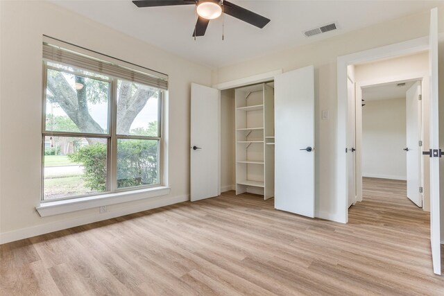 1601 Elk Grove Dr, Richardson, TX 75081 - unfurnished bedroom featuring light wood-style floors, baseboards, a closet, and a ceiling fan