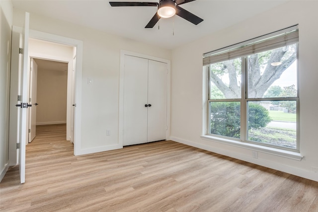 1601 Elk Grove Dr, Richardson, TX 75081 - unfurnished bedroom featuring light wood-style flooring, baseboards, and a closet