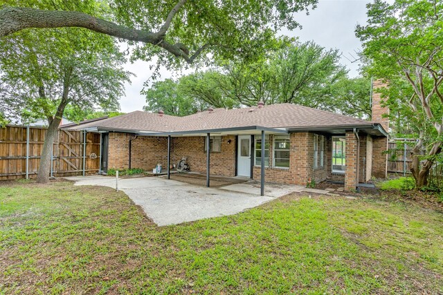 1601 Elk Grove Dr, Richardson, TX 75081 - rear view of house with a chimney, a patio, a gate, and brick siding