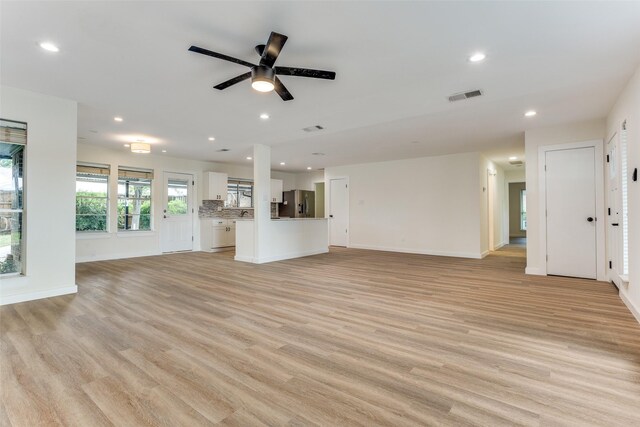 1601 Elk Grove Dr, Richardson, TX 75081 - unfurnished living room featuring recessed lighting, light wood-style floors, a ceiling fan, and baseboards