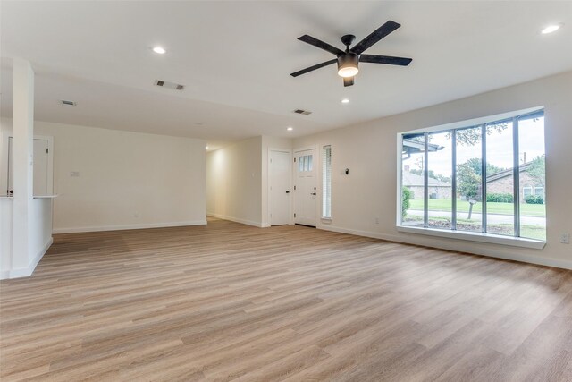 1601 Elk Grove Dr, Richardson, TX 75081 - unfurnished living room with light wood-type flooring, recessed lighting, baseboards, and ceiling fan