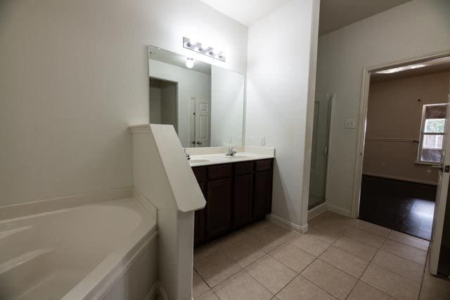 3412 Spruce St, Royse City, TX 75189 - full bath featuring tile patterned floors, a garden tub, and double vanity