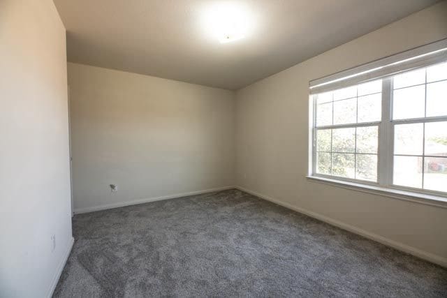 3412 Spruce St, Royse City, TX 75189 - empty room with carpet flooring and baseboards