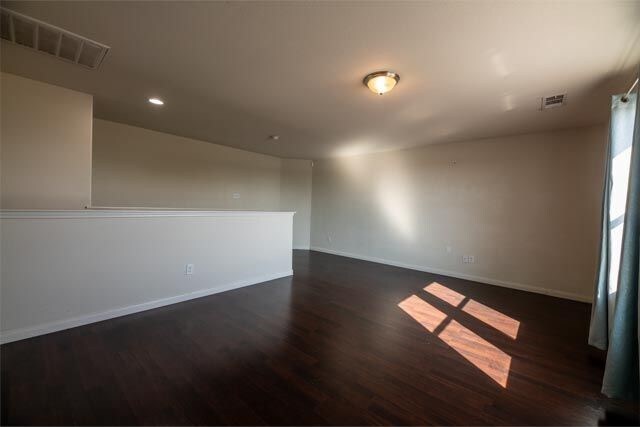 3412 Spruce St, Royse City, TX 75189 - unfurnished room with dark wood-style flooring, baseboards, and recessed lighting