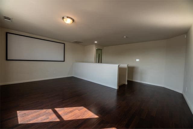 3412 Spruce St, Royse City, TX 75189 - spare room featuring wood finished floors and baseboards