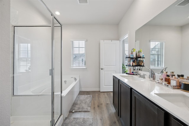 2028 Saddle Way, Mesquite, TX 75149 - full bath featuring wood finished floors, a shower stall, a bath, and plenty of natural light