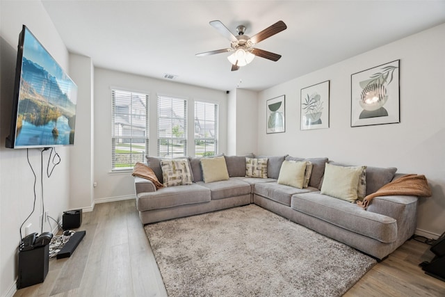 2028 Saddle Way, Mesquite, TX 75149 - living room featuring a ceiling fan, wood finished floors, and baseboards