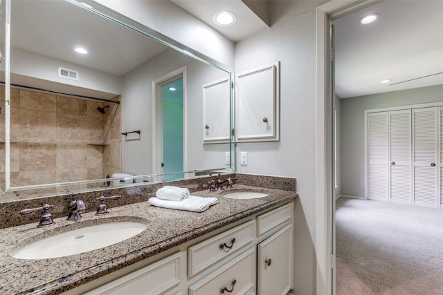 4023 Candlenut Ln, Dallas, TX 75244 - full bathroom with double vanity, recessed lighting, and a shower