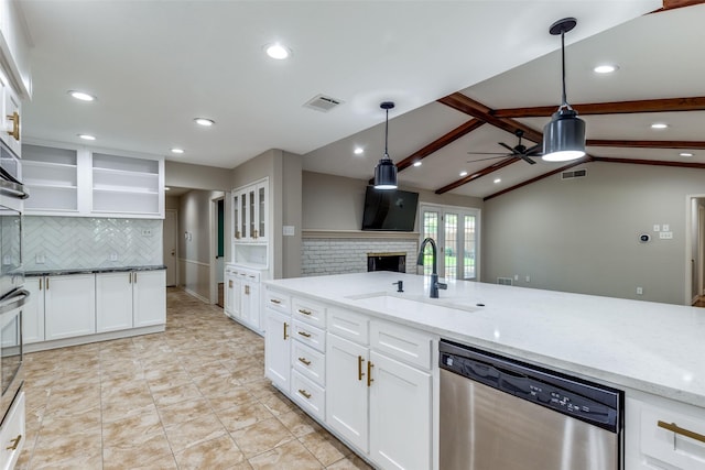 4023 Candlenut Ln, Dallas, TX 75244 - kitchen featuring dishwasher, a sink, tasteful backsplash, ceiling fan, and light stone countertops