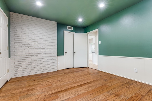 4023 Candlenut Ln, Dallas, TX 75244 - unfurnished bedroom featuring wainscoting, wood finished floors, and recessed lighting