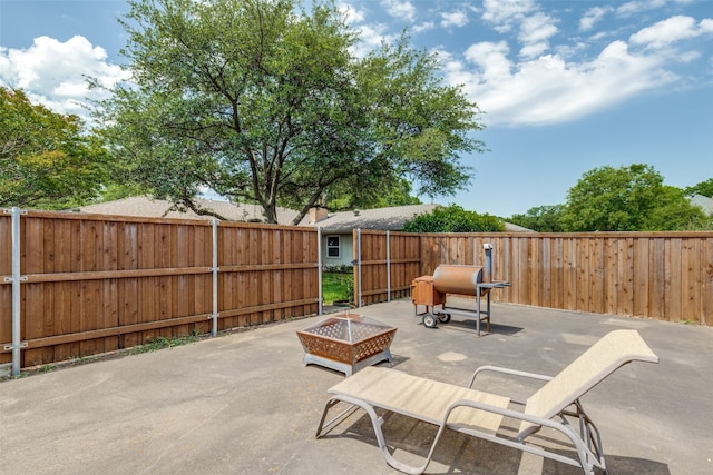 4023 Candlenut Ln, Dallas, TX 75244 - fenced backyard featuring a patio area and a fire pit