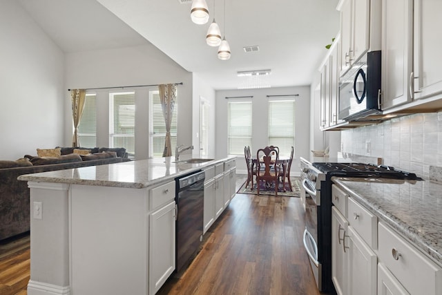 15717 Preble Rd, Fort Worth, TX 76177 - kitchen with gas stove, black dishwasher, a sink, and dark wood-style flooring