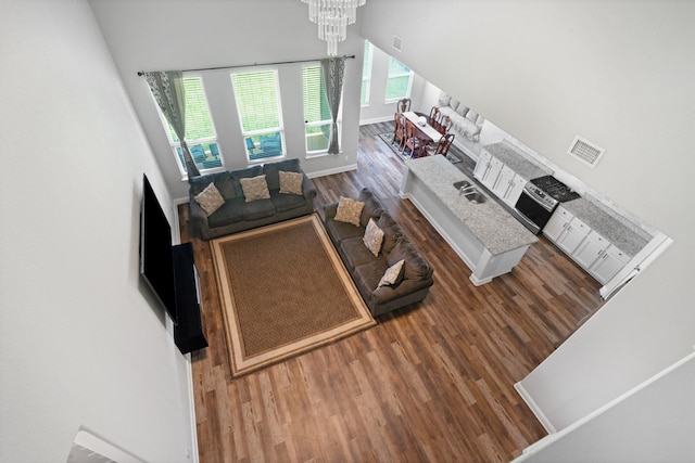15717 Preble Rd, Fort Worth, TX 76177 - living room with wood finished floors and a chandelier