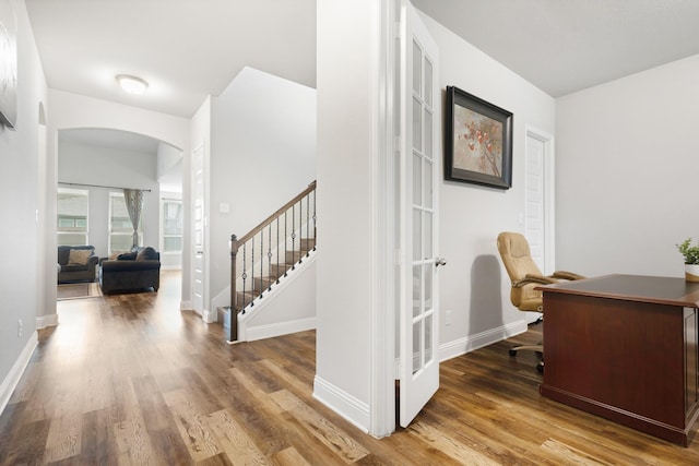 15717 Preble Rd, Fort Worth, TX 76177 - home office with arched walkways, wood finished floors, and baseboards