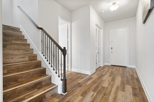 15717 Preble Rd, Fort Worth, TX 76177 - entryway with wood finished floors, stairway, and baseboards