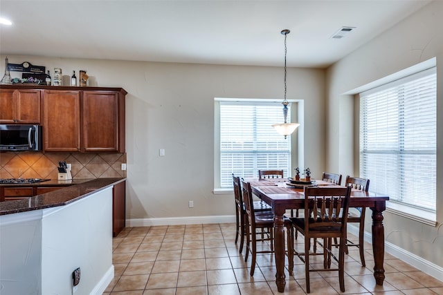 1616 Teakwood Dr, Wylie, TX 75098 - dining area with light tile patterned floors and baseboards