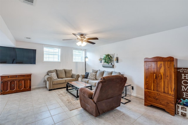 141 Stonegate Ct, Bedford, TX 76022 - living area with a ceiling fan, light tile patterned floors, and baseboards