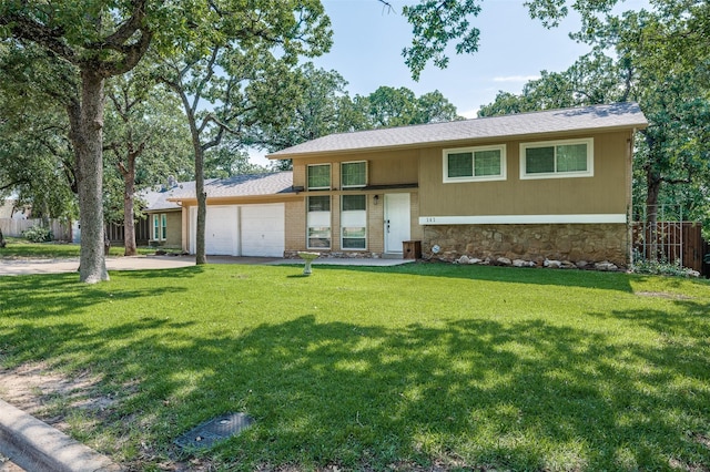 141 Stonegate Ct, Bedford, TX 76022 - view of front facade featuring stone siding, an attached garage, and driveway