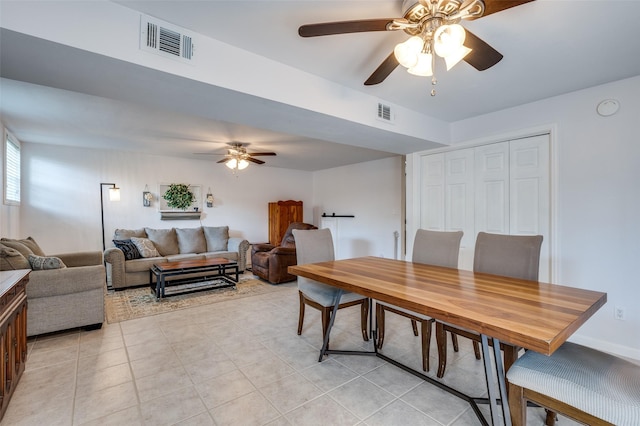 141 Stonegate Ct, Bedford, TX 76022 - dining area featuring a ceiling fan and light tile patterned floors