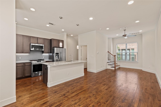 5909 Ross Ave Unit 2, Dallas, TX 75206 - kitchen with stainless steel appliances, a sink, recessed lighting, ornamental molding, and tasteful backsplash