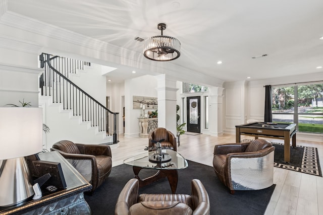1117 Charleston Ct, Keller, TX 76248 - living room featuring ornate columns, light wood-type flooring, crown molding, stairway, and recessed lighting
