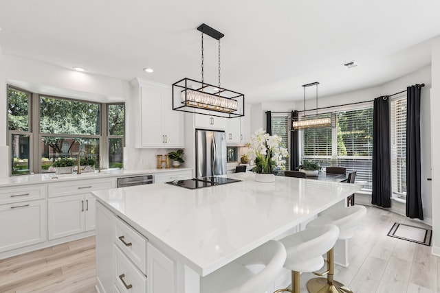 1117 Charleston Ct, Keller, TX 76248 - kitchen with stainless steel appliances, a sink, a center island, healthy amount of natural light, and recessed lighting