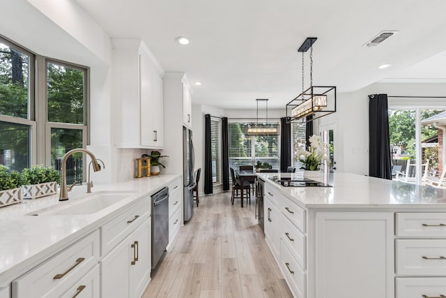 1117 Charleston Ct, Keller, TX 76248 - kitchen with a sink, appliances with stainless steel finishes, plenty of natural light, white cabinets, and recessed lighting
