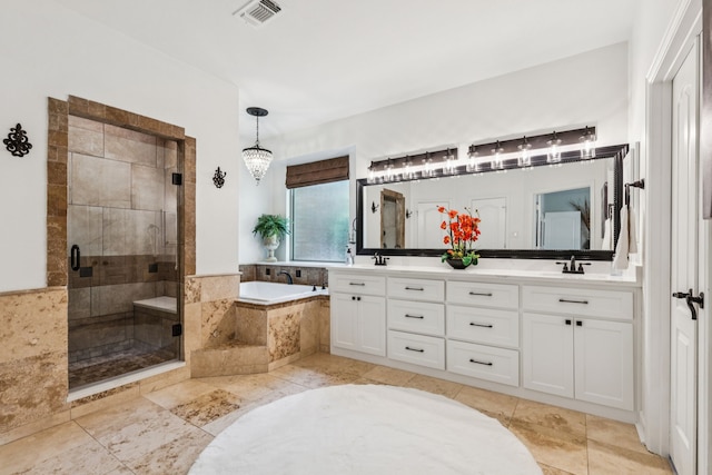 1117 Charleston Ct, Keller, TX 76248 - full bath featuring a bath, double vanity, a stall shower, a chandelier, and tile patterned flooring