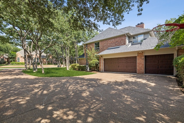 1117 Charleston Ct, Keller, TX 76248 - view of front of home featuring driveway, brick siding, a chimney, an attached garage, and a shingled roof