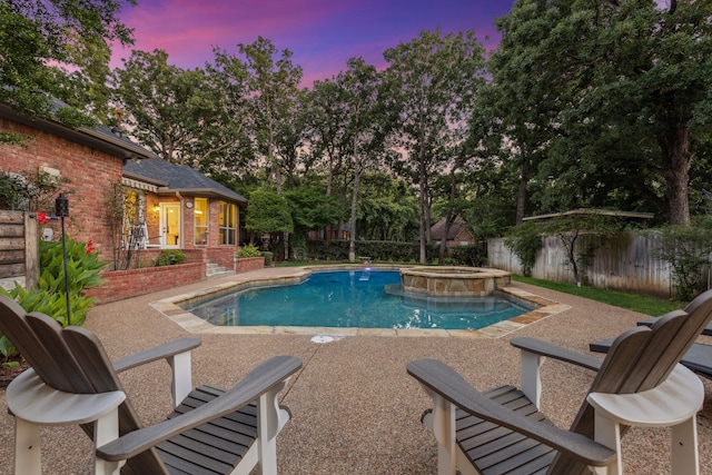 1117 Charleston Ct, Keller, TX 76248 - pool at dusk with a patio, a fenced backyard, and a pool with connected hot tub