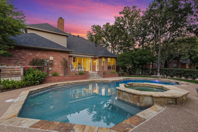 1117 Charleston Ct, Keller, TX 76248 - pool at dusk with a pool with connected hot tub